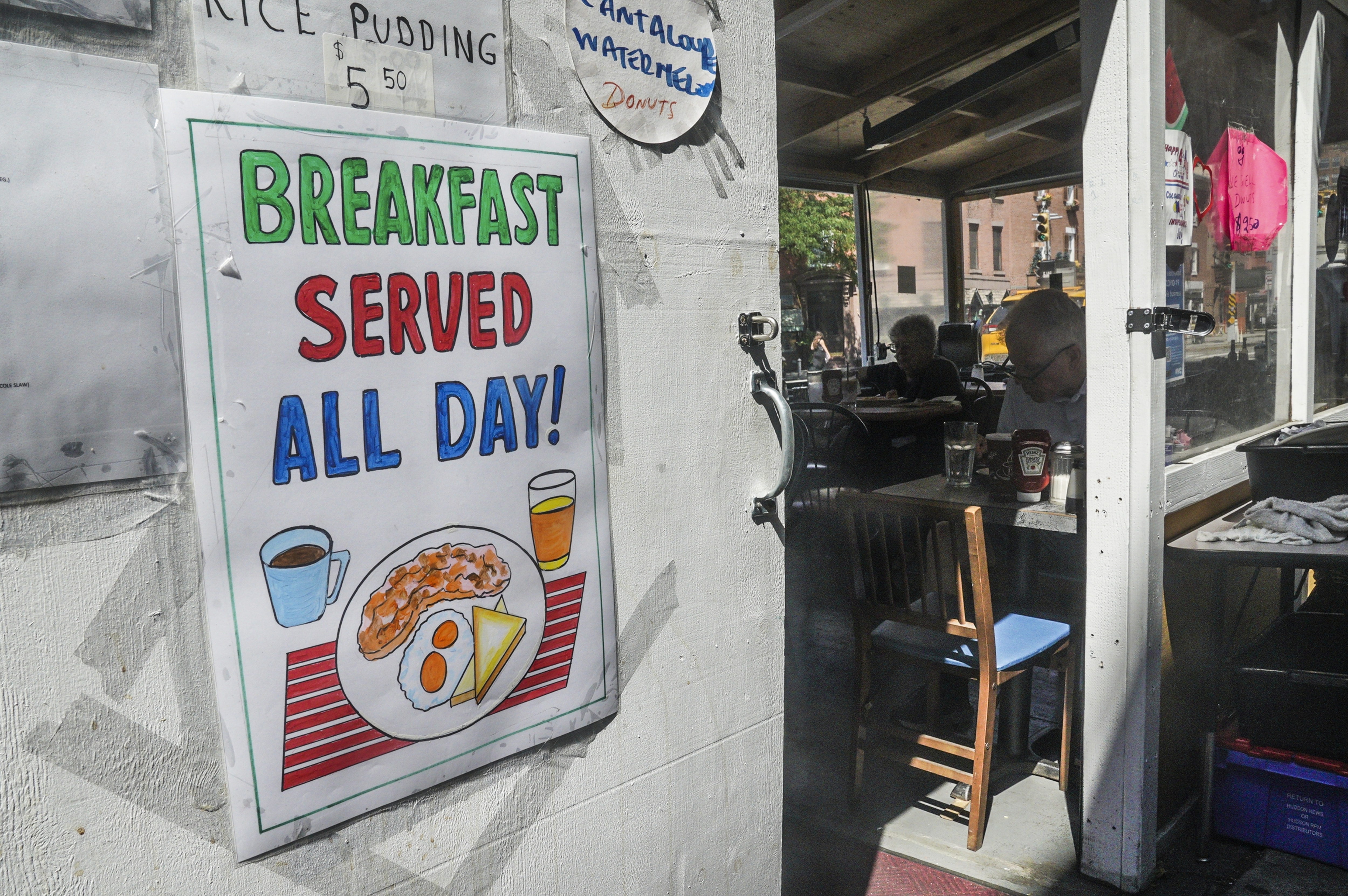 A poster created brothers Miguel and Carlos Cevallos, is displayed at La Bonbonniere diner, Tuesday, Aug. 30, 2022, in New York. For years the Cevallos, octogenarian brothers from Ecuador, made a living drawing posters for nightclubs, taco trucks and restaurants, attracting clients by word of mouth, but an Instagram account changed a lot of that. (AP Photo/Bebeto Matthews) (AP) A poster created brothers Miguel and Carlos Cevallos, is displayed at La Bonbonniere diner, Tuesday, Aug. 30, 2022, in New York. For years the Cevallos, octogenarian brothers from Ecuador, made a living drawing posters for nightclubs, taco trucks and restaurants, attracting clients by word of mouth, but an Instagram account changed a lot of that. (AP Photo/Bebeto Matthews) (AP)