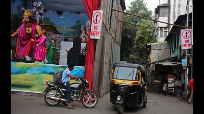 Commuters pass from ‘no entry’ zone in Sadashiv peth on Sunday. (Ravindra Joshi/HT PHOTO)