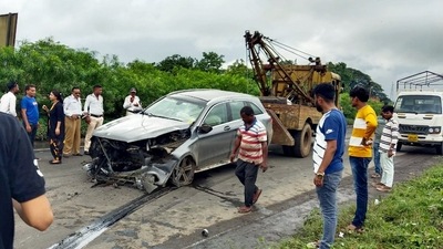 Wrecked remains of a car being dragged by a crane in which former chairman of Tata Sons Cyrus Mistry died in a crash in Palghar on Sunday. (ANI) Wrecked remains of a car being dragged by a crane in which former chairman of Tata Sons Cyrus Mistry died in a crash in Palghar on Sunday. (ANI)