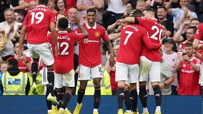 Manchester United's Marcus Rashford, centre, celebrates after scoring his side's second goal (AP)