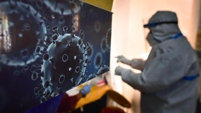 An illustration of the novel coronavirus seen next to a health care worker at a Covid-19 testing centre in New Delhi (Sanchit Khanna / HT Photo) An illustration of the novel coronavirus seen next to a health care worker at a Covid-19 testing centre in New Delhi (Sanchit Khanna / HT Photo)