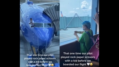 The image, taken from the viral video, shows a pilot playing ‘rock, paper, and scissors’ with a kid.&nbsp; (Instagram/@goodnews_movement)