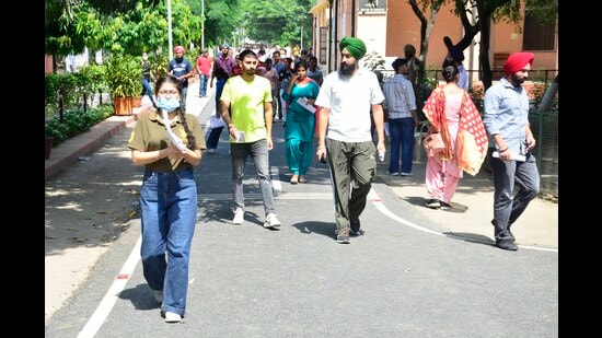 Students coming out of the examination center after appearing for the UPSC exam in Ludhiana on Sunday.  (Harvinder Singh/HT)