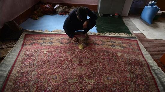 A weaver works on a Kashmiri handmade silk carpet. Kashmir is seeking geographical indication (GI) tagging under intellectual property rights for five of its crafts, some of which are also its cultural markers. (Waseem Andrabi/HT)