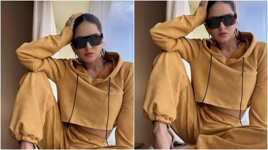 Sunny decked up in a cropped ochre hoodie and a pair of ochre trousers and looked super cool in the outfit.(Instagram/@sunnyleone)