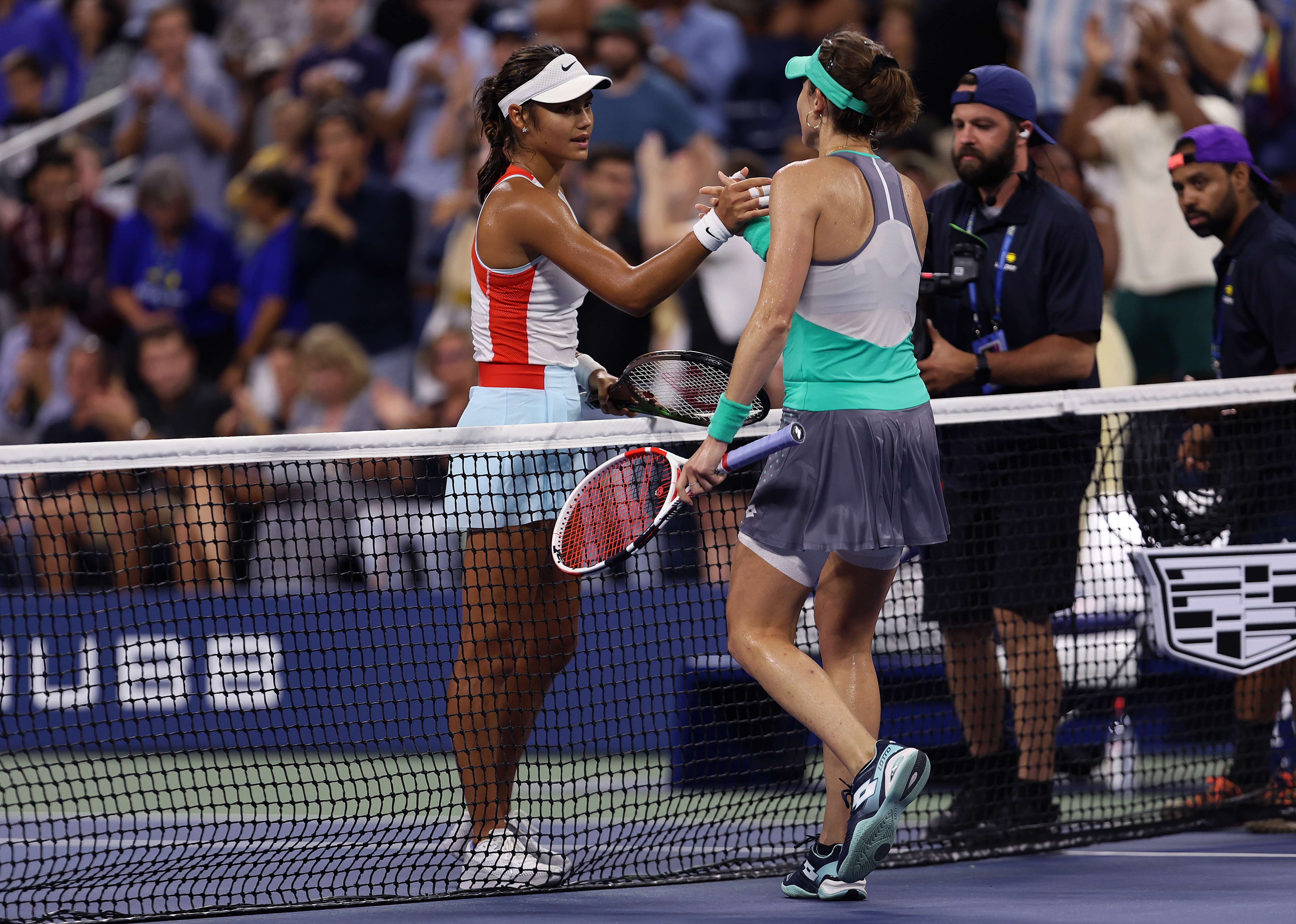 Alize Cornet of France is congratulated by Emma Raducanu of Great Britain after their Women's Singles First Round match on Day Two of the 2022 US Open Alize Cornet of France is congratulated by Emma Raducanu of Great Britain after their Women's Singles First Round match on Day Two of the 2022 US Open