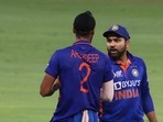 Asia Cup 2022: Rohit Sharma talks to Arshdeep Singh during India vs Pakistan Super 4 stage match.(REUTERS)