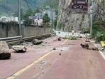 In this photo provided by China's Xinhua News Agency, fallen rocks are seen on a road near Lengqi Town in Luding County of southwest China's Sichuan Province Monday.(AP) In this photo provided by China's Xinhua News Agency, fallen rocks are seen on a road near Lengqi Town in Luding County of southwest China's Sichuan Province Monday.(AP)