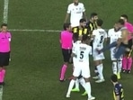 The pitch invader unleashed a 'kung-fu kick' before he was slammed by a teammate of the former Premier League star