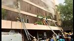 Fumes billow out as firefighters carry out a rescue operation after a fire broke out at a hotel in Lucknow on Monday. (ANI PHOTO) Fumes billow out as firefighters carry out a rescue operation after a fire broke out at a hotel in Lucknow on Monday. (ANI PHOTO)