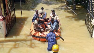 Residents of a locality being ferried by firefighters after the area partially submerged following incessant rain, in Bengaluru. (ANI) Residents of a locality being ferried by firefighters after the area partially submerged following incessant rain, in Bengaluru. (ANI)