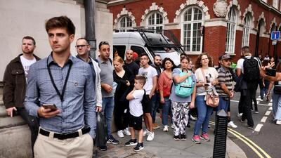 People watch the arrivals at the Queen Elizabeth II Conference Centre where a new British Prime Minister was announced in London, Britain, on Monday. (REUTERS)