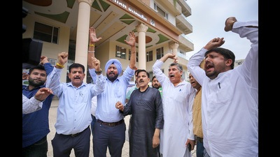 Aam Aadmi Party activists stage a protest outside the J&K Election Commission office over special summary revision of electoral rolls in Jammu, Monday. (PTI) Aam Aadmi Party activists stage a protest outside the J&K Election Commission office over special summary revision of electoral rolls in Jammu, Monday. (PTI)