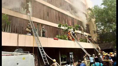 Fumes billow out as firefighters carry out a rescue operation after a fire broke out at a hotel in Lucknow on Monday. (ANI PHOTO) Fumes billow out as firefighters carry out a rescue operation after a fire broke out at a hotel in Lucknow on Monday. (ANI PHOTO)