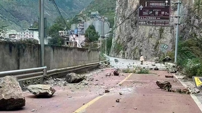 In this photo provided by China's Xinhua News Agency, fallen rocks are seen on a road near Lengqi Town in Luding County of southwest China's Sichuan Province Monday. (AP) In this photo provided by China's Xinhua News Agency, fallen rocks are seen on a road near Lengqi Town in Luding County of southwest China's Sichuan Province Monday. (AP)