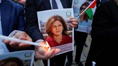 People light candles during a vigil in memory of Al Jazeera journalist Shireen Abu Akleh, who was killed during an Israeli raid, outside the Church of the Nativity in Bethlehem, in the Israeli-occupied West Bank. (Reuters File Image)