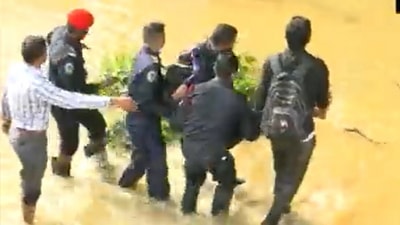 A few local security guards pulled out a man in an unconscious state out of flood waters in Bengaluru. (ANI)