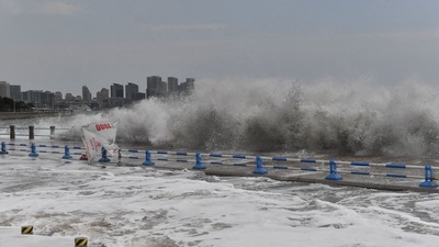 Waves generated by Typhoon Hinnamnor break along the coast in Qingdao in China's eastern Shandong province on Monday. (AFP)