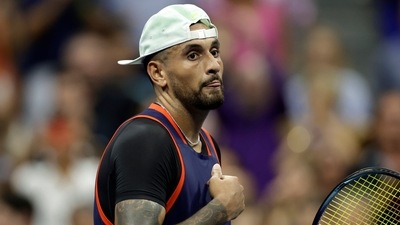 Nick Kyrgios walks across the court after winning his match against Daniil Medvedev&nbsp; (AP)