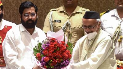 Raj Bhavan officials confirmed that governor BS Koshyari (right) has approved the Eknath Shinde (left) government’s decision to withdraw the nominations sent by previous Uddhav Thackeray government for the Maharashtra legislative council. (AFP File Photo) Raj Bhavan officials confirmed that governor BS Koshyari (right) has approved the Eknath Shinde (left) government’s decision to withdraw the nominations sent by previous Uddhav Thackeray government for the Maharashtra legislative council. (AFP File Photo)