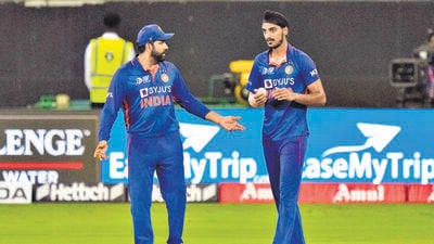 India's Arshdeep Singh, right, listens to captain Rohit Sharma before bowling his next delivery during the T20 cricket match of Asia Cup between India and Pakistan, in Dubai, United Arab Emirates. (AP) India's Arshdeep Singh, right, listens to captain Rohit Sharma before bowling his next delivery during the T20 cricket match of Asia Cup between India and Pakistan, in Dubai, United Arab Emirates. (AP)