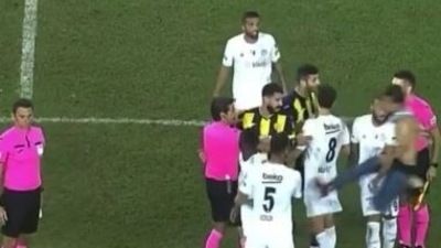 The pitch invader unleashed a 'kung-fu kick' before he was slammed by a teammate of the former Premier League star (beIN Sports/Screenshot )