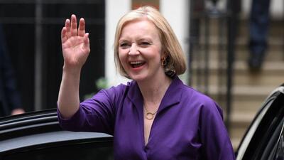 New Conservative Party leader and incoming PM Liz Truss smiles and waves as she arrives at Conservative Party headquarters in London having been announced the winner of the leadership contest, on Monday. (AFP) New Conservative Party leader and incoming PM Liz Truss smiles and waves as she arrives at Conservative Party headquarters in London having been announced the winner of the leadership contest, on Monday. (AFP)