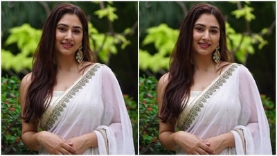 Disha teamed the white six yards with a sleeveless blouse featuring a wide U neckline, a cut-out on the back attached with a tassel-adorned dori tie, and heavy silver sequinned embroidery. (Instagram)