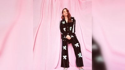 Tamannaah Bhatia's set comes in velvet texture and features white floral prints. She teamed it with a pair of silver pumps. (Instagram/@tamannaahspeaks) Tamannaah Bhatia's set comes in velvet texture and features white floral prints. She teamed it with a pair of silver pumps. (Instagram/@tamannaahspeaks)