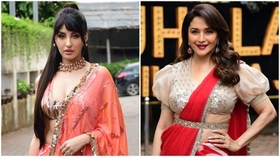 Nora Fatehi and Madhuri Dixit turn retro goddesses in stylish sarees for Jhalak Dikhhla Jaa 10 (HT Photo/Varinder Chawla) Nora Fatehi and Madhuri Dixit turn retro goddesses in stylish sarees for Jhalak Dikhhla Jaa 10 (HT Photo/Varinder Chawla)