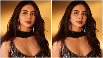 Lastly, for the glam picks, Rakul chose glossy mauve lip shade, subtle nude eye shadow, kohl-lined eyes and lids, mascara on the lashes, blushed cheeks, and dewy skin. A centre-parted open hairdo, silver dangling earrings, a black clutch, rings and a sleek bracelet added the finishing touch. (Instagram) Lastly, for the glam picks, Rakul chose glossy mauve lip shade, subtle nude eye shadow, kohl-lined eyes and lids, mascara on the lashes, blushed cheeks, and dewy skin. A centre-parted open hairdo, silver dangling earrings, a black clutch, rings and a sleek bracelet added the finishing touch. (Instagram)