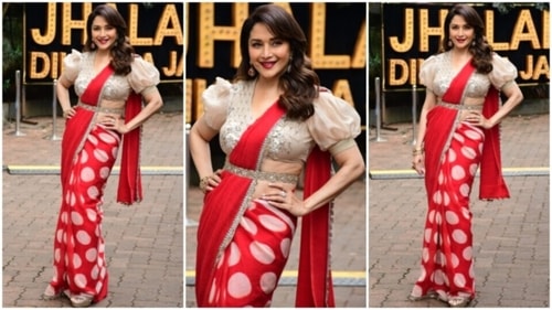 Madhuri Dixit wears a red printed saree and embellished beige blouse. (HT Photo/Varinder Chawla) Madhuri Dixit wears a red printed saree and embellished beige blouse. (HT Photo/Varinder Chawla)