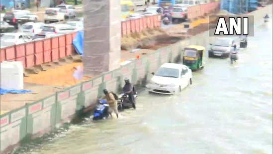 Several parts of Bengaluru remain inundated due to severe waterlogging after heavy rainfall. Here is a visual from Eco space area on Marathahalli - Silk Board junction road.(ANI)