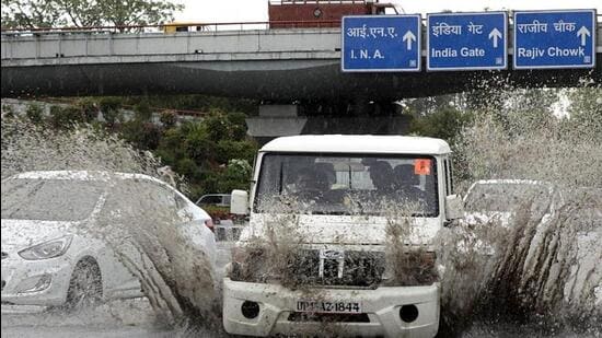 Waterlogging after a short spell of rain at AIIMS flyover in New Delhi. (HT File Photo)