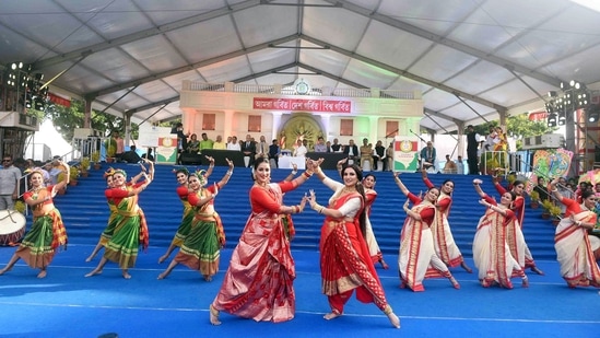 Artists dressed up in traditional attires perform during a rally taken out by West Bengal Chief Minister Mamata Banerjee.(ANI)