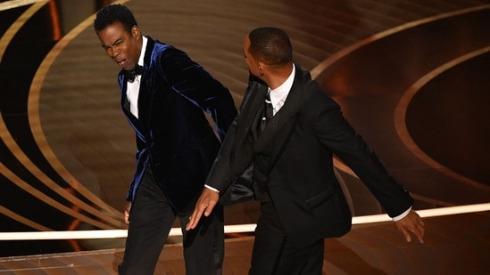 In this file photo taken on March 27, 2022, Will Smith (R) slaps Chris Rock onstage during the 94th Oscars at the Dolby Theatre in Hollywood, California. (Photo by Robyn Beck / AFP)(AFP)