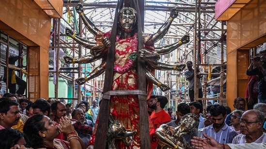 The festival of Durga Puja will be observed from October 1 this year and will go on till October 5. It starts with Mahalaya (September 25) with the ritual of 'pran pratistha' which is done by painting the eyes on the idol goddess Durga. Sasthi, Saptami, Ashtami are the other auspicious days with their own significance and rituals. The celebrations culminate on Vijaya Dashami day when the idols are immersed in rivers. After a two-year hiatus due to the global Covid-19 pandemic, the City of Joy Kolkata is finally happy to host one of the country's biggest festivals once again with much favour and enthusiasm.(AFP)