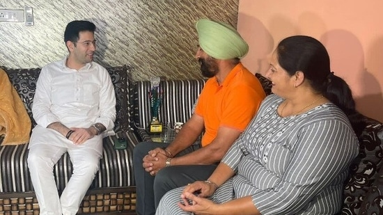 Aam Aadmi Party (AAP) MP Raghav Chadha with parents of Indian pacer Arshdeep Singh.