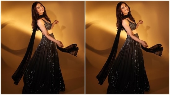 On Sunday, Rakul Preet Singh dropped several pictures of herself dressed in a sequinned black lehenga and bralette set. The actor captioned her post, "[black heart emoji] Always a desi girl." The lehenga set is from the shelves of designer Sawan Gandhi's clothing label and is a perfect pick for attending cocktail parties, receptions or ring ceremonies.(Instagram)