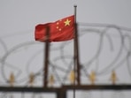 Chinese flag in China's western Xinjiang region.(AFP) Chinese flag in China's western Xinjiang region.(AFP)