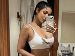 Malaika Arora drops the perfect mirror selfie in white sports bra and cycling shorts, serves style inspiration for gym (Instagram) Malaika Arora drops the perfect mirror selfie in white sports bra and cycling shorts, serves style inspiration for gym (Instagram)