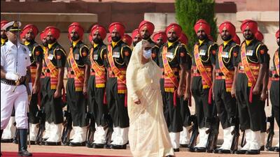 Ahead of the meeting, Hasina was accorded a tri-services guard of honour on the forecourt of Rashtrapati Bhavan on Tuesday morning. (Bloomberg) Ahead of the meeting, Hasina was accorded a tri-services guard of honour on the forecourt of Rashtrapati Bhavan on Tuesday morning. (Bloomberg)