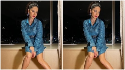Assisted by makeup artist Kin Vanity, Sunny decked up in smokey eyeshadow, black eyeliner, black kohl, mascara-laden eyelashes, drawn eyebrows, contoured cheeks and a shade of bright red lipstick. (Instagram/@sunnyleone)