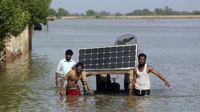 Victims of unprecedented flooding from monsoon rains use a cot to salvage belongings from their flooded home, in Jaffarabad, Pakistan, Monday. (AP) Victims of unprecedented flooding from monsoon rains use a cot to salvage belongings from their flooded home, in Jaffarabad, Pakistan, Monday. (AP)