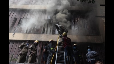 Firefighter trying to douse the fire at hotel Levana Suites (HT FIle Photo)