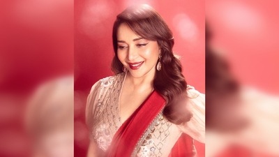Adding a contemporary touch to her retro look, Madhuri Dixit wore a shimmery saree waist belt that elevated her entire look. (Instagram/@madhuridixitnene) Adding a contemporary touch to her retro look, Madhuri Dixit wore a shimmery saree waist belt that elevated her entire look. (Instagram/@madhuridixitnene)