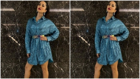 Sunny decked up in a shimmery blue shirt dress featuring collars and full sleeves. The dress also came with a silver belt detail at the waist.(Instagram/@sunnyleone)