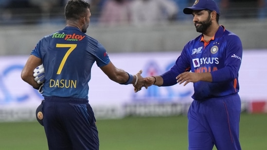 India's captain Rohit Sharma, right, shake hands with Sri Lanka's captain Dasun Shanaka to congratulate him(AP)