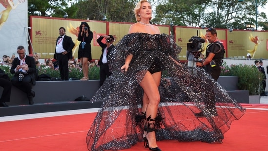 Florence Pugh poses for photographers upon arrival at the premiere of the film Don't Worry Darling.(Vianney Le Caer/Invision/AP)