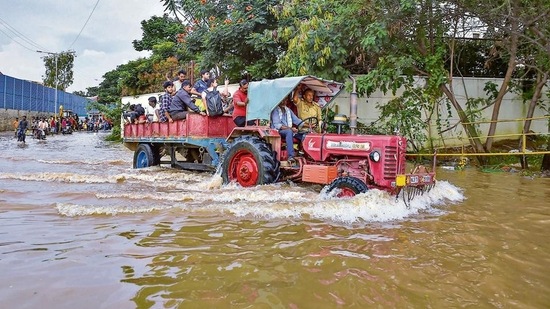 A tractor being used to evacuate people stranded at the waterlogged Yemalur area after heavy monsoon rains, in Bengaluru, Tuesday, September 6, 2022. (PTI Photo/Shailendra Bhojak)